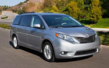 2013 Toyota Sienna XLE front three quarters in motion